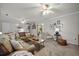 Spacious living room featuring a large sectional sofa, ceiling fans, and neutral decor at 401 Amy Dr, Goose Creek, SC 29445