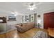Inviting living room with hardwood floors, a comfortable leather sofa, and bright natural light at 401 Amy Dr, Goose Creek, SC 29445
