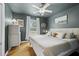 Serene main bedroom with wood floors, a plush bed, soft lighting, and modern decor at 401 Amy Dr, Goose Creek, SC 29445