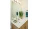 Bathroom featuring a large mirror, white countertops and vanity, and decorative touches at 401 S Elgin Ct # 401, Charleston, SC 29414