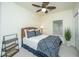 Cozy bedroom with wicker headboard, ceiling fan, natural light, and comfortable decor at 401 S Elgin Ct # 401, Charleston, SC 29414