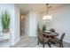 Cozy dining area with a dark wood table, stylish chairs, modern lighting, and a mirror on the wall at 401 S Elgin Ct # 401, Charleston, SC 29414