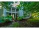 Two story home featuring a brick pathway, front porch and lush landscaping at 401 S Elgin Ct # 401, Charleston, SC 29414