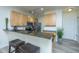 Modern kitchen featuring light wood cabinets, granite countertops, stainless steel appliances and breakfast bar with seating at 401 S Elgin Ct # 401, Charleston, SC 29414