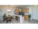 Eat-in kitchen with stainless steel appliances, breakfast bar, granite countertop and pendant lighting at 401 S Elgin Ct # 401, Charleston, SC 29414