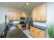 Modern kitchen featuring light wood cabinets, granite countertops, stainless steel appliances and breakfast bar with seating at 401 S Elgin Ct # 401, Charleston, SC 29414