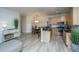 Eat-in kitchen with stainless steel appliances, breakfast bar, granite countertop and pendant lighting at 401 S Elgin Ct # 401, Charleston, SC 29414