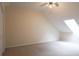Attic room featuring a skylight for natural light and neutral carpet, fresh paint and closet at 403 Sunny Side Way, Summerville, SC 29485