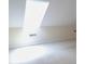 Attic space filled with sunlight from a skylight, neutral carpet, and fresh paint at 403 Sunny Side Way, Summerville, SC 29485