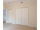 Bedroom with bi-fold closet, neutral carpet, fresh paint and nearby access to other parts of the home at 403 Sunny Side Way, Summerville, SC 29485