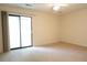 Bedroom with sliding glass door to balcony providing natural light, with neutral carpet and fresh paint at 403 Sunny Side Way, Summerville, SC 29485