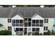 Aerial view of townhouse with screened-in porches, colorful siding, and an inviting entryway at 403 Sunny Side Way, Summerville, SC 29485