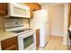Functional kitchen featuring white appliances, oak cabinets and plenty of counter space at 403 Sunny Side Way, Summerville, SC 29485