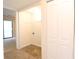 A cozy laundry room with tile flooring, shelving, and convenient hookups at 403 Sunny Side Way, Summerville, SC 29485