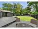 View of the backyard deck and a spacious lawn, perfect for outdoor entertaining and relaxation at 403 Wedgewood St, Charleston, SC 29407