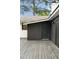 Exterior shot of the house with a dark door leading from the backyard deck, stylish outdoor living at 403 Wedgewood St, Charleston, SC 29407