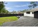 Spacious backyard featuring a wooden deck and outdoor seating, perfect for relaxation and entertainment at 403 Wedgewood St, Charleston, SC 29407