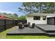 A backyard patio space with a fire pit and outdoor seating, ideal for cozy evenings at 403 Wedgewood St, Charleston, SC 29407