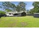 Expansive backyard featuring a deck, patio, and a storage shed, offering plenty of outdoor space at 403 Wedgewood St, Charleston, SC 29407