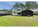 View of a large backyard with a deck and patio, perfect for entertaining and enjoying the outdoors at 403 Wedgewood St, Charleston, SC 29407