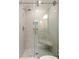 Elegant glass-enclosed shower with corner seat and hexagon tile, offering a luxurious bathing experience at 403 Wedgewood St, Charleston, SC 29407