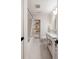 Clean bathroom with a white vanity, marble countertop, and built-in shelving at 403 Wedgewood St, Charleston, SC 29407