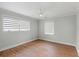 Bright bedroom with hardwood floors, ceiling fan and modern zebra blinds for light control and style at 403 Wedgewood St, Charleston, SC 29407