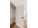 Walk-in closet with built-in shelving, adjacent to a bedroom, hardwood floor at 403 Wedgewood St, Charleston, SC 29407