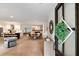 Bright entryway leading to the living room with hardwood floors, dining area, and open-concept kitchen at 403 Wedgewood St, Charleston, SC 29407