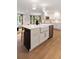 Kitchen island with a white countertop, black cabinets, sink, and stainless steel appliances at 403 Wedgewood St, Charleston, SC 29407