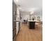 Bright, open kitchen with stainless appliances, white cabinets, and black island at 403 Wedgewood St, Charleston, SC 29407