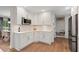 Bright kitchen with white cabinets, stainless appliances, and white subway tile backsplash at 403 Wedgewood St, Charleston, SC 29407