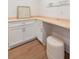 Well-lit laundry room with white cabinets, light wood countertop and decor that reads 'Laundry Today' at 403 Wedgewood St, Charleston, SC 29407