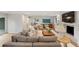 Spacious living area with a cozy sectional sofa, fireplace, and stylish decor; perfect for relaxation at 403 Wedgewood St, Charleston, SC 29407