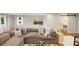 Relaxing living room with a large sectional sofa, view to the backyard and elegant interior design at 403 Wedgewood St, Charleston, SC 29407