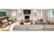 Comfortable living room featuring a brick fireplace, built-in shelving and plenty of seating space at 403 Wedgewood St, Charleston, SC 29407