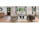 Inviting living room with hardwood floors, comfortable seating, large window, and abundant light at 403 Wedgewood St, Charleston, SC 29407