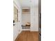 Mud room with white cabinets, bench seating, and a view of the front yard at 403 Wedgewood St, Charleston, SC 29407