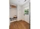 Mud room with white cabinets, bench seating, and a view of the backyard at 403 Wedgewood St, Charleston, SC 29407