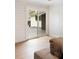 Bright sliding door with backyard view and white wood-paneled walls creates a serene indoor-outdoor flow at 403 Wedgewood St, Charleston, SC 29407