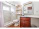 Bright bathroom featuring a modern vanity with a white countertop and custom mirror, plus walk-in shower with beachy tones at 405 Palmetto Blvd, Edisto Island, SC 29438