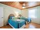 Bright bedroom with twin beds, wooden accents, and soft natural lighting at 405 Palmetto Blvd, Edisto Island, SC 29438