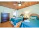Quaint bedroom with twin beds, wooden accents, and a chest of drawers at 405 Palmetto Blvd, Edisto Island, SC 29438