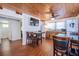 Bright kitchen offers appliances, wooden cabinets, breakfast area, wood ceilings, and access to bathroom at 405 Palmetto Blvd, Edisto Island, SC 29438