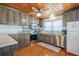 Charming kitchen featuring stainless steel appliances, wooden cabinets, and light countertops at 405 Palmetto Blvd, Edisto Island, SC 29438