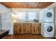 Kitchen with appliances, wooden cabinets, breakfast area, wood ceilings and flooring at 405 Palmetto Blvd, Edisto Island, SC 29438