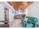 Cozy living room with wood ceilings, ceiling fans, comfortable seating and views into kitchen at 405 Palmetto Blvd, Edisto Island, SC 29438