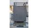 Enclosed outdoor shower area featuring wooden plank construction, a handle, and weathered gray paint at 405 Palmetto Blvd, Edisto Island, SC 29438