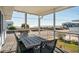Inviting outdoor dining space with ocean views from covered porch at 405 Palmetto Blvd, Edisto Island, SC 29438