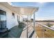 Relaxing porch with water views, outdoor seating and an outdoor rug creating a cozy atmosphere at 405 Palmetto Blvd, Edisto Island, SC 29438
